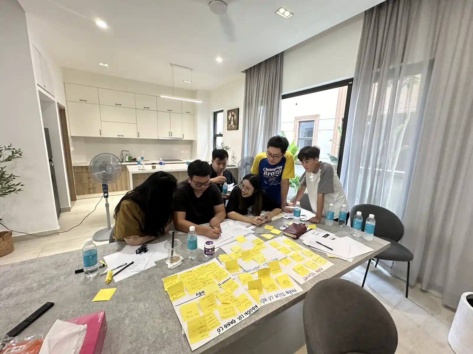 PATI teammates at a strategy workshop in the office