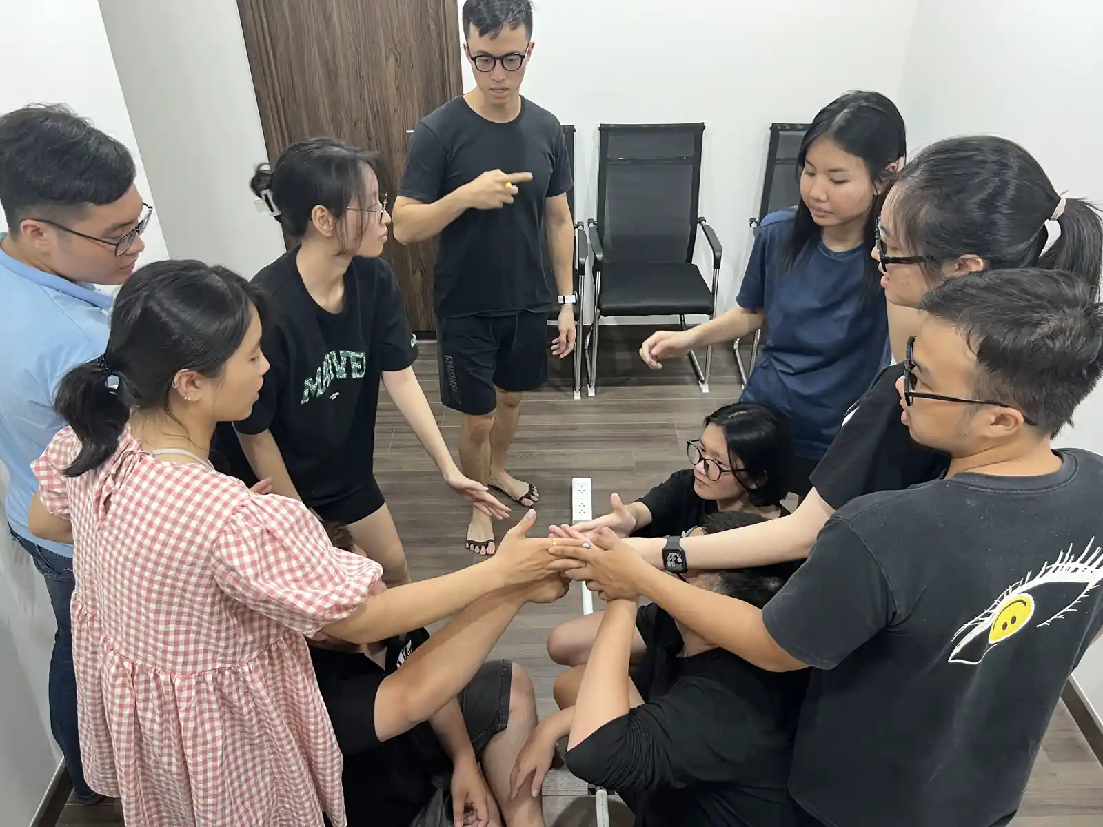 Office huddle, hands in