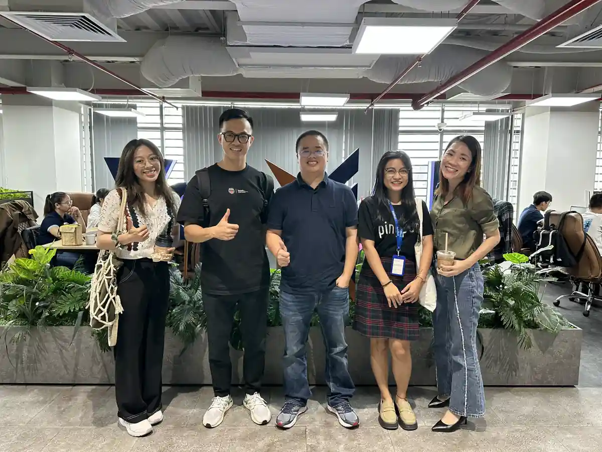Five teammates in the open-plan office